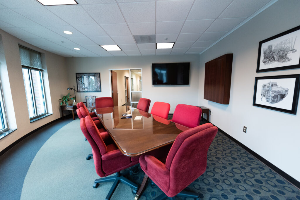 Conference Room table with red chairs